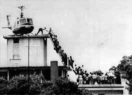 South Vietnamese load onto a helicopter to escape the wrath of North Vietnamese.