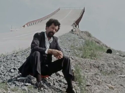 Ken Carter sitting by the ramp constructed for his rocket car.